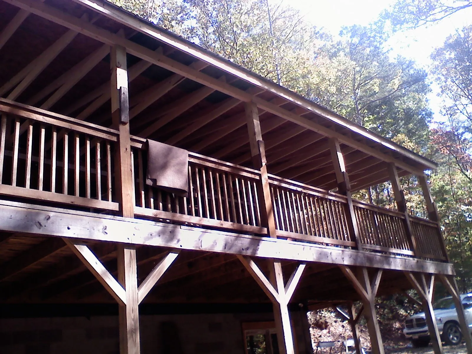 Timber framing under a new elevated porch and deck — Roof Leak Repair in Simsbury by Roofing Brothers